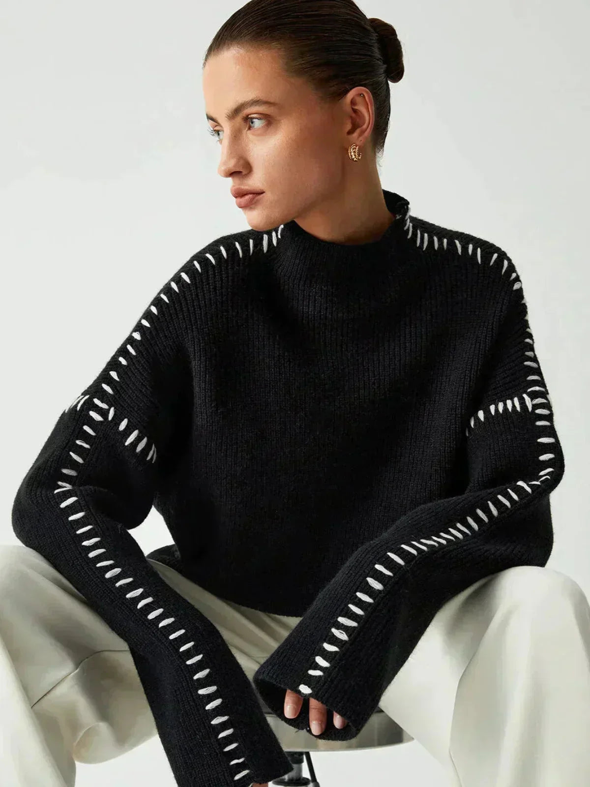 Black Valentina oversized wool sweater for women by Christine Brewer, featuring ribbed knit and mock neck design.