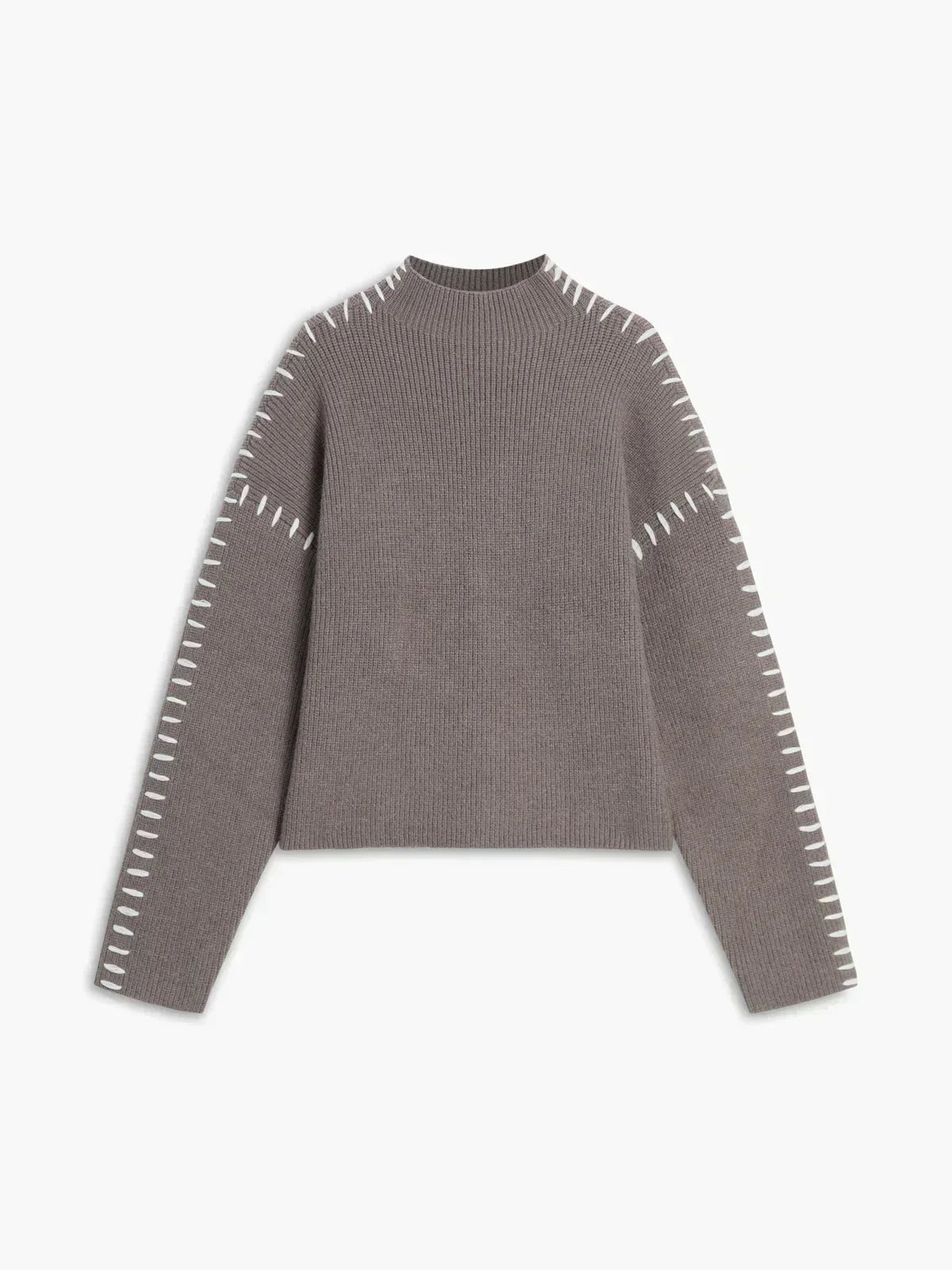 Camel-colored oversized wool sweater with ribbed mock neck and whipstitch detailing, designed for autumn wear by Christine Brewer.
