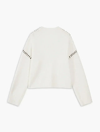 White ribbed wool oversized sweater by Christine Brewer, featuring a mock neck and whipstitch details, perfect for autumn.