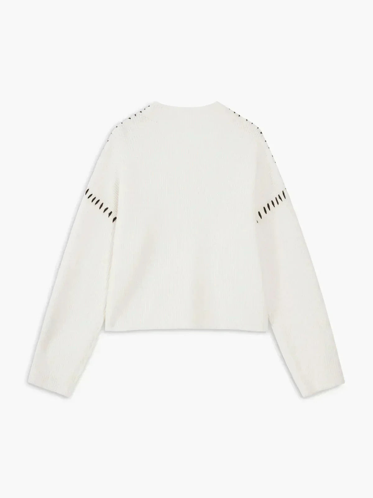 White ribbed wool oversized sweater by Christine Brewer, featuring a mock neck and whipstitch details, perfect for autumn.