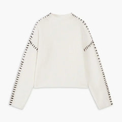 White ribbed wool oversized sweater for women by Christine Brewer, featuring a mock neck and whipstitch detail.