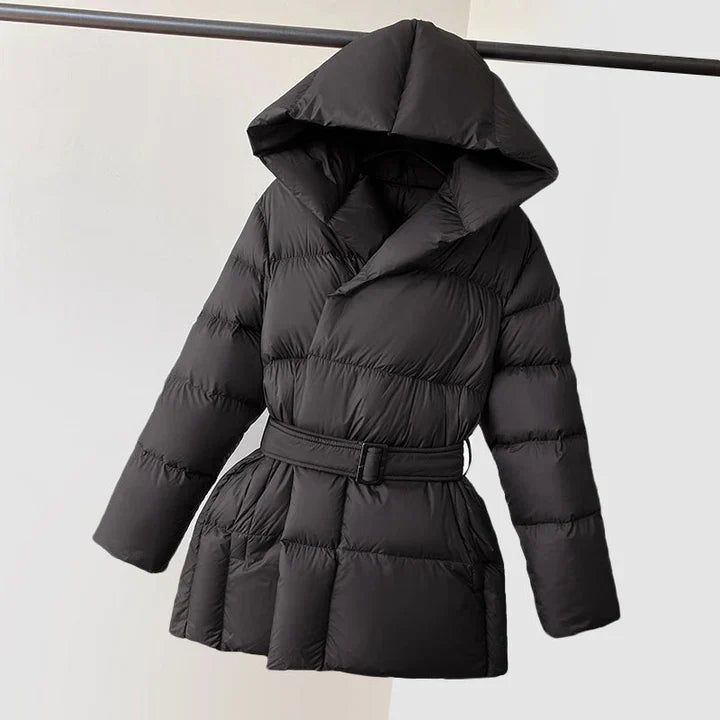 Black Ella belted hooded puffer jacket for women by Christine Brewer, featuring a front belt, hood, and quilted insulation.