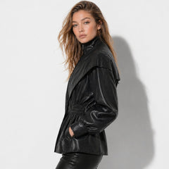 Manon cinched waist faux leather jacket for women by Christine Brewer, featuring sleek design and stylish details.