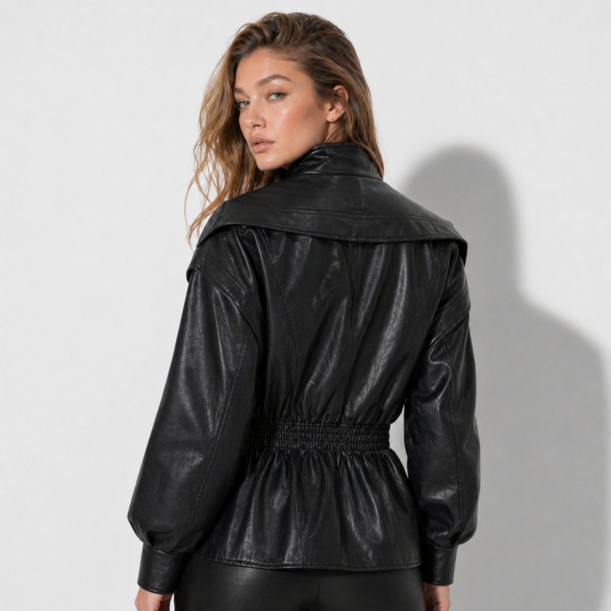 Manon cinched waist faux leather jacket for women by Christine Brewer, showcasing sleek design and stylish fit.