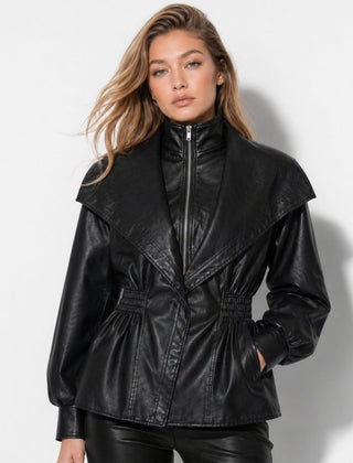 Manon black faux leather jacket for women, featuring a cinched waist and sleek design by Christine Brewer.
