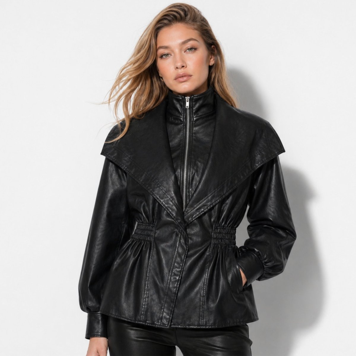 Manon black faux leather jacket for women, featuring a cinched waist and sleek design by Christine Brewer.