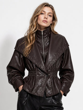 Dark brown faux leather jacket for women by Christine Brewer, featuring a sleek, cinched waist design.