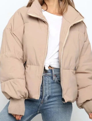 Beige Emily stand collar puffer jacket for women by Christine Brewer, featuring a cozy, stylish winter jacket with a stand collar.