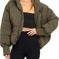 Green Emily stand collar puffer jacket for women by Christine Brewer, shown on a model with a stylish, insulated winter jacket.