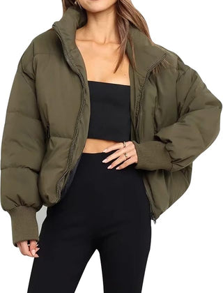 Green Emily stand collar puffer jacket for women by Christine Brewer, shown on a model with a stylish, insulated winter jacket.
