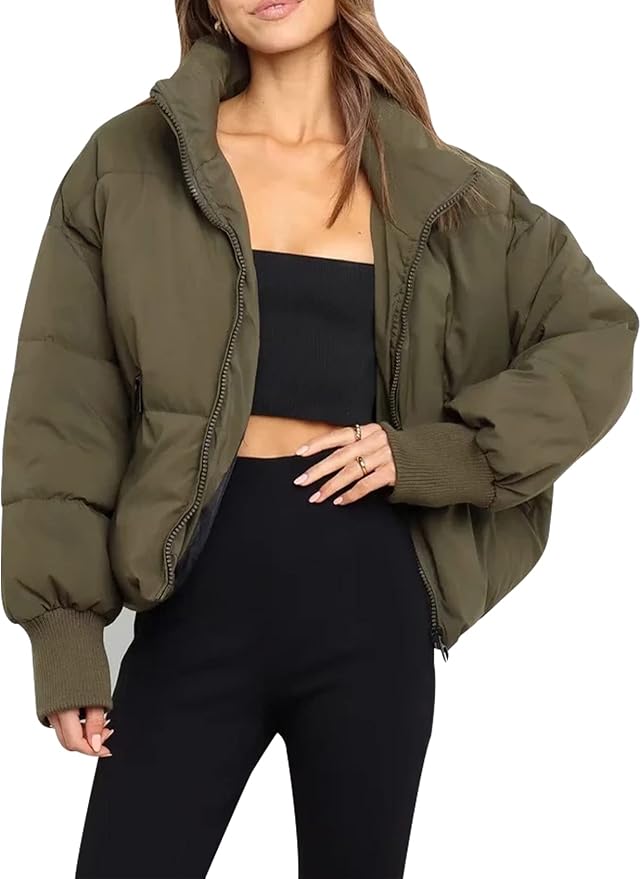 Green Emily stand collar puffer jacket for women by Christine Brewer, shown on a model with a stylish, insulated winter jacket.