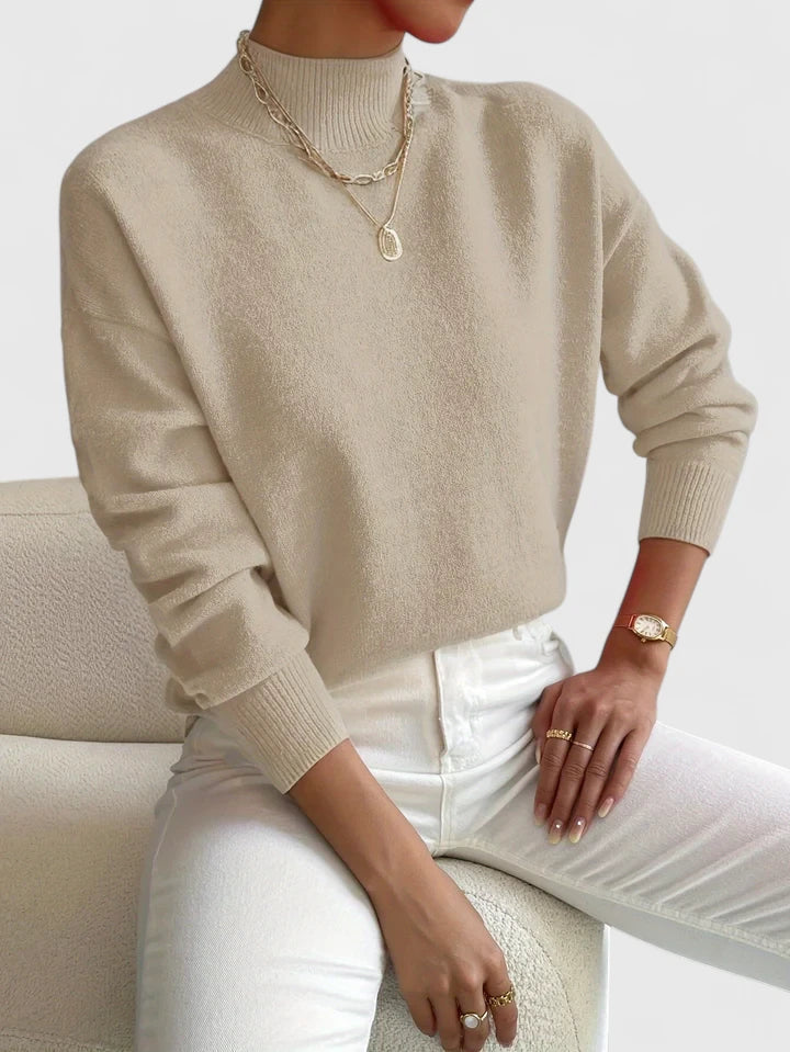 Woman wearing a cozy Erin turtleneck sweater for women by Christine Brewer, featuring a comfortable, stylish fit.