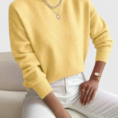 Women’s Erin turtleneck sweater by Christine Brewer, featuring a cozy, elegant knit in a comfortable fit, shown on a model.
