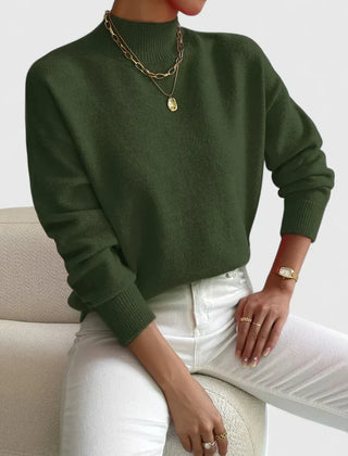 Cozy beige turtleneck sweater by Christine Brewer, featuring a versatile and comfortable design, ideal for casual wear.