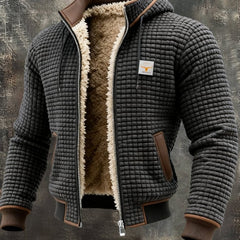 Men's quilted fleece-lined hooded zip-up thermal jacket by Christine Brewer, showing the fleece lining and quilted exterior.