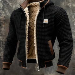 Men's quilted fleece-lined hooded zip-up thermal jacket by Christine Brewer, showing the jacket's quilted exterior and fleece-lined interior.