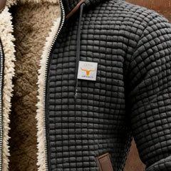 Men's quilted fleece-lined hooded zip-up thermal jacket by Christine Brewer with a warm fleece interior and quilted exterior.