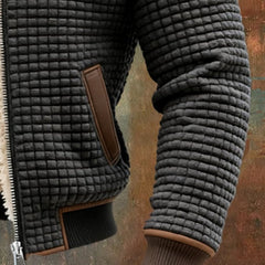 Men's quilted fleece-lined hooded zip-up thermal coat by Christine Brewer, shown in a cozy, insulated design with a front zipper and hood.