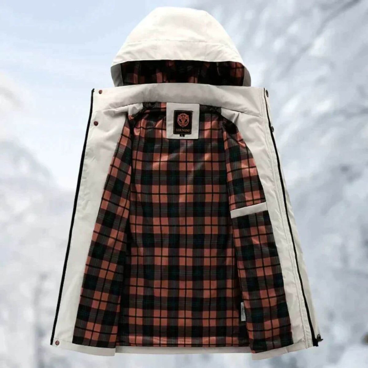 Men's quilted waterproof hooded outdoor coat by Christine Brewer, featuring windproof design and durable outdoor jacket style.