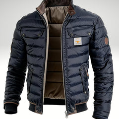 Men's quilted puffer jacket by Christine Brewer with padded insulation, stand collar, ideal for winter wear.