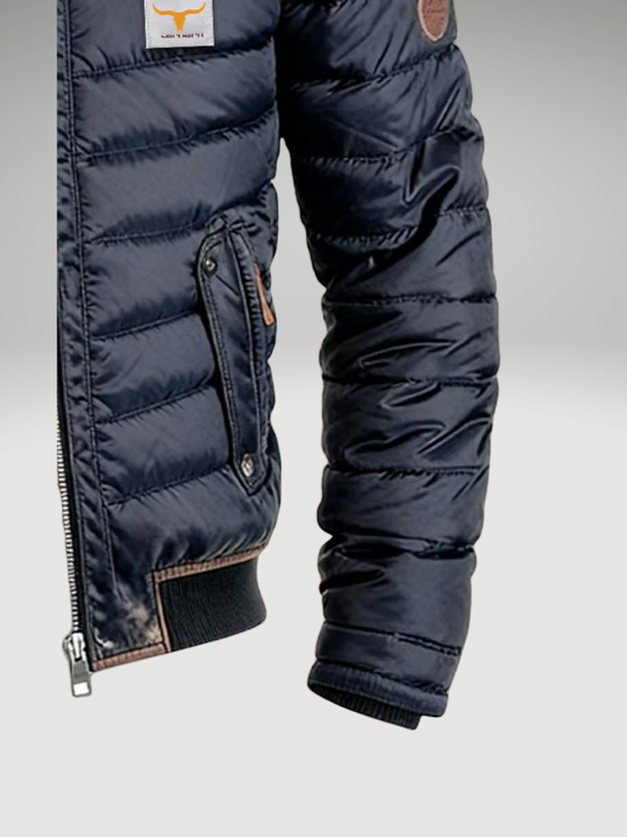 Men's quilted puffer jacket by Christine Brewer featuring a padded design and stand collar, suitable for winter wear.