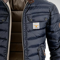 Men's quilted puffer jacket with stand collar, padded winter coat by Christine Brewer, shown in navy blue with zip closure and side pockets.