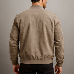 Slim-fit men's quilted suede bomber jacket by Christine Brewer, featuring a classic design with detailed stitching and a stylish collar.