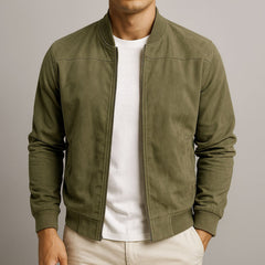 Men's slim-fit quilted suede bomber jacket by Christine Brewer, featuring a stylish design with a front zipper and ribbed cuffs.