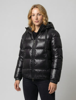 Black Abigail quilted puffer jacket for women by Christine Brewer, showcasing its quilted design and cozy fit.
