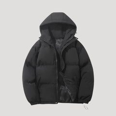 Black Evelyn hooded puffer jacket for women by Christine Brewer, featuring insulation and a cozy hood for cold weather.