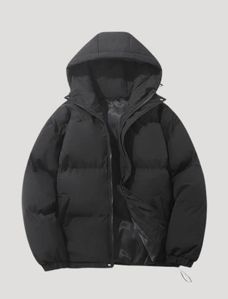 Black Evelyn hooded puffer jacket for women by Christine Brewer, featuring insulation and a cozy hood for cold weather.