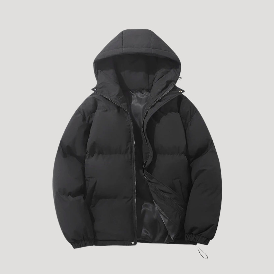 Black Evelyn hooded puffer jacket for women by Christine Brewer, featuring insulation and a cozy hood for cold weather.