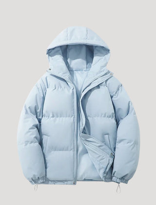 Blue Evelyn hooded puffer jacket for women by Christine Brewer, featuring insulated design and cozy hood for cold weather.
