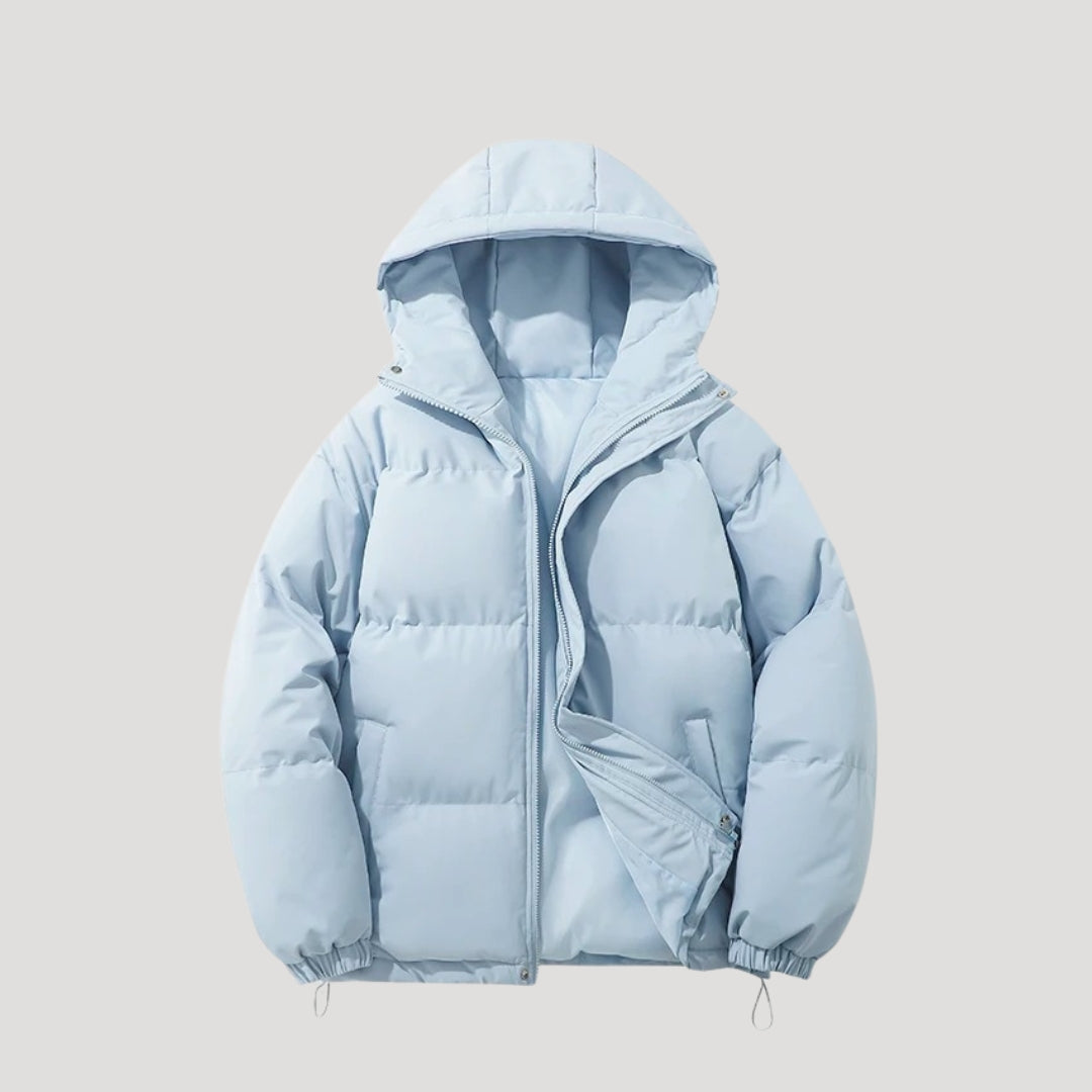 Blue Evelyn hooded puffer jacket for women by Christine Brewer, featuring insulated design and cozy hood for cold weather.
