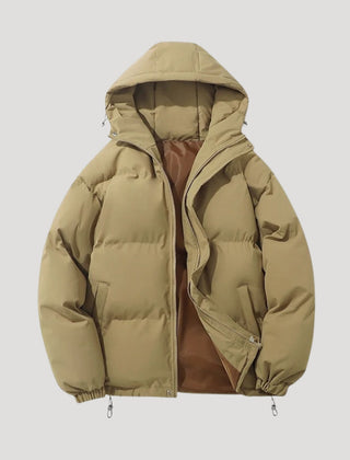 Brown Evelyn hooded puffer jacket for women by Christine Brewer, showcasing the insulated quilted design and cozy hood.