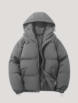 Gray Evelyn hooded puffer jacket for women by Christine Brewer, featuring insulated padding and a cozy hood.