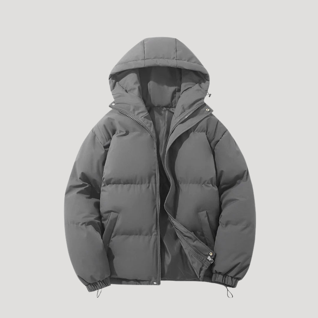 Gray Evelyn hooded puffer jacket for women by Christine Brewer, featuring insulated padding and a cozy hood.