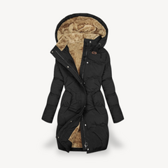 Black Mia long hooded puffer jacket for women by Christine Brewer, featuring a cozy hood and quilted design for warmth.