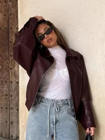 Romy oversized faux leather jacket for women by Christine Brewer, featuring a stylish, relaxed fit with sleek black leather appearance.