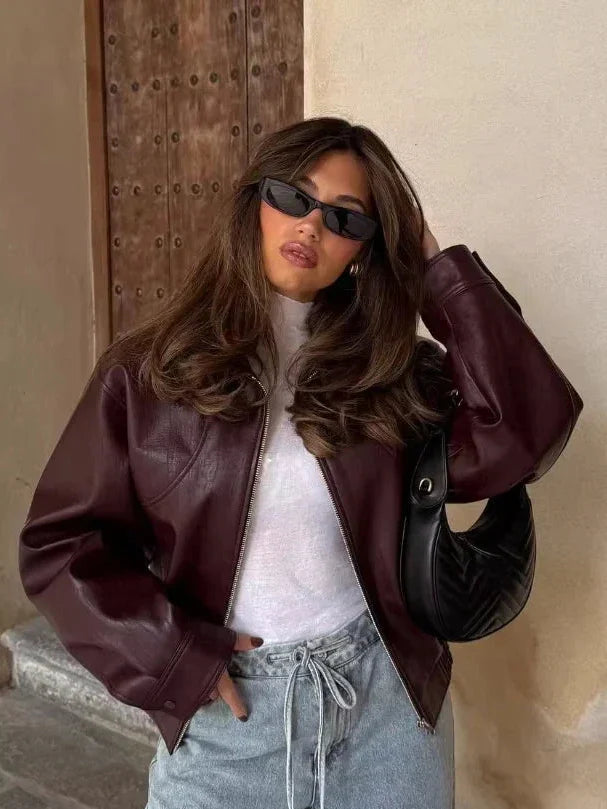 Wine red oversized faux leather jacket for women from Christine Brewer's Elena collection, featuring a stylish, relaxed fit.
