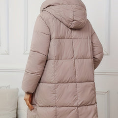 Mid-length black hooded puffer jacket for women by Christine Brewer, featuring a cozy hood and quilted design for warmth and style.