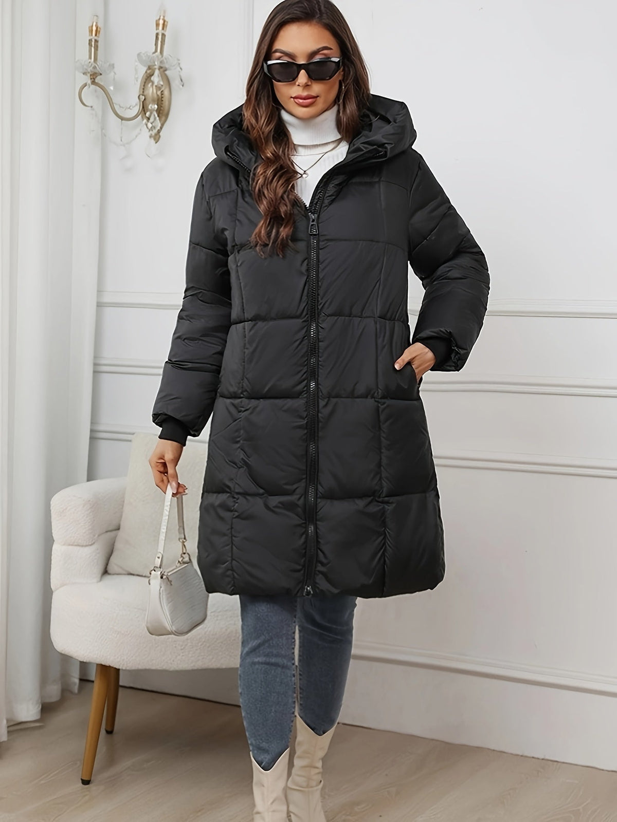 Black Harper hooded puffer jacket for women by Christine Brewer, mid-length design with a cozy hood and quilted insulation.