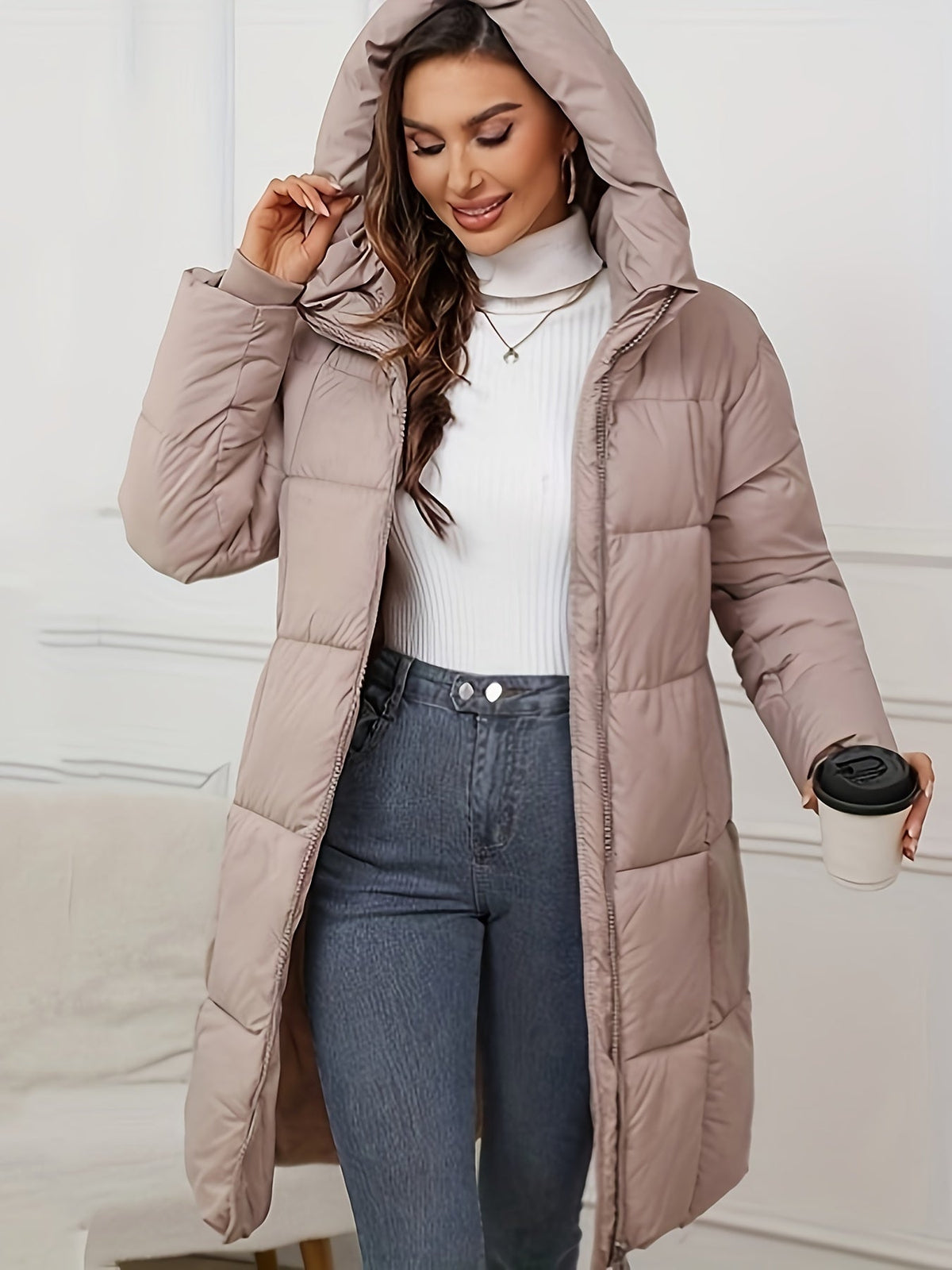Mid-length khaki hooded puffer jacket for women by Christine Brewer, featuring a cozy hood and quilted design.