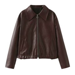 Women's cropped faux leather jacket by Christine Brewer, featuring a fitted style and stylish design.