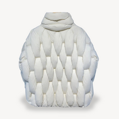 Sage plush puffer jacket for women by Christine Brewer, featuring a cozy, quilted design and a high collar for warmth and style.