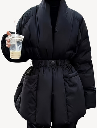 Black Charlotte belted quilted puffer jacket for women by Christine Brewer, featuring a stylish quilted design and belt detail.