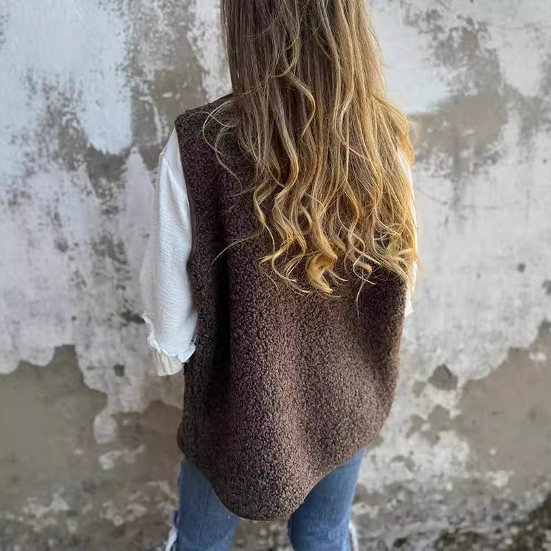 Christine Brewer Paige sleeveless knit vest for women, showing a close-up of the beige sleeveless sweater with a high neckline and ribbed texture.