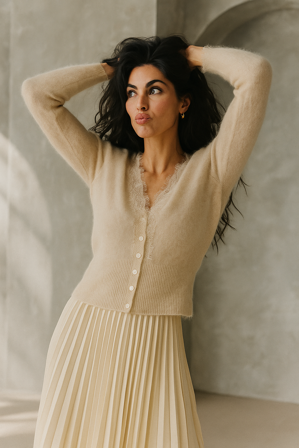 Elsa cashmere cardigan for women by Christine Brewer, soft knit sweater with a relaxed fit and button closure, in a neutral color.