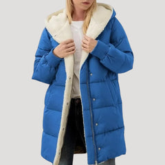 Olivia women's hooded puffer jacket by Christine Brewer in blue with faux fur trim on the hood.