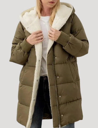Green Olivia hooded puffer jacket for women by Christine Brewer, featuring a faux fur-lined hood and quilted design.